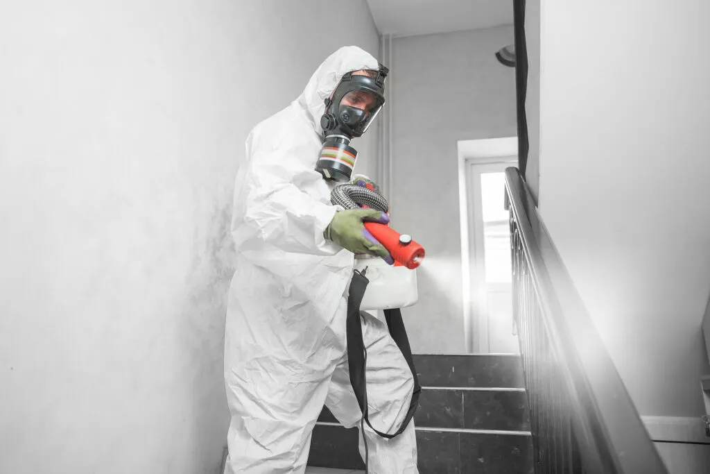 Concept Coronavirus Disinfection. People In Hazmats Making Clean
